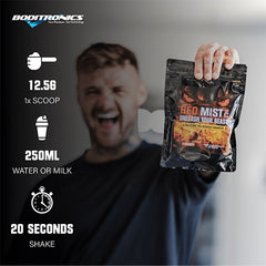 Boditronics Ambassador Ryan holding up Red Mist 375g orange and passionfruit pouch with mixing instructions mix 12.5g 1 scoop with 250ml water or milk then shake for 20 seconds