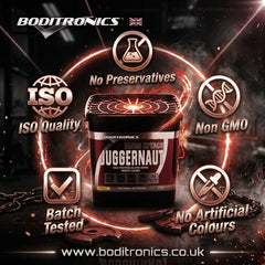 A tub of Boditronics Juggernaut Mass Attack heavy metal coloring grade powder is centered in a dark promotional graphic with glowing orange rings and text badges reading 'No Preservatives,' 'ISO Quality,' 'Non GMO,' 'Batch Tested,' and 'No Artificial Colours.'.