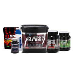 A collection of Boditronics supplements, including a large black container "Mass Attack Heavyweight Strawberries and cream" a red and black pouch labeled "Red Mist," a blue and clear shaker bottle, a bottle of "Bodiarmour" multivitamins, and two black containers labelled "Creatine Explosion" and "BCAA "Intracell"