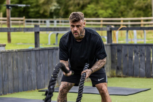 Boditronic's Athlete Ryan Robinson completes an endurance workout on the Battle Ropes