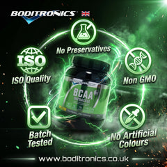 A cinematic promotional graphic highlighting the quality standards of Boditronics XTRA BCAA Intracell against a dark, smokey green backdrop with glowing particle effects. A large black supplement tub with a green "BCAA Intracell" label is positioned in the center, framed by a swirling circular band of green electric energy. Surrounding the tub are five quality badge stamps with glowing green and white icons and text: "No Preservatives" (top, flask icon), "ISO Quality" (left, globe icon), "Non GMO" 