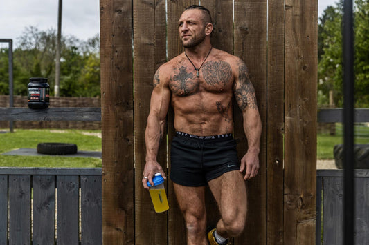 Boditronics' Athlete Anthony Holmes with Creatine Explosion in a shaker bottle